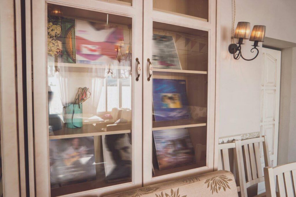 cupboard-with-glass-doors-covers-with-pictures-collection-of-vinyl-records-music-from-good-times-1